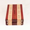 Bloodwood and Maple Compact Travel Cribbage Board showing the barrel hinges that are invisible when the board is opened.