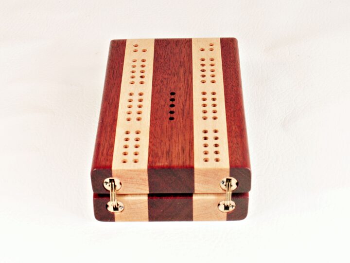 Bloodwood and Maple Compact Travel Cribbage Board showing the barrel hinges that are invisible when the board is opened.