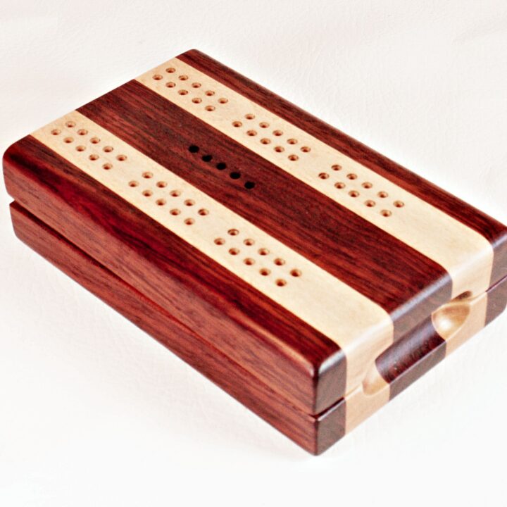 A Bubinga and Maple Travel Cribbage Board closed up and ready for travels.